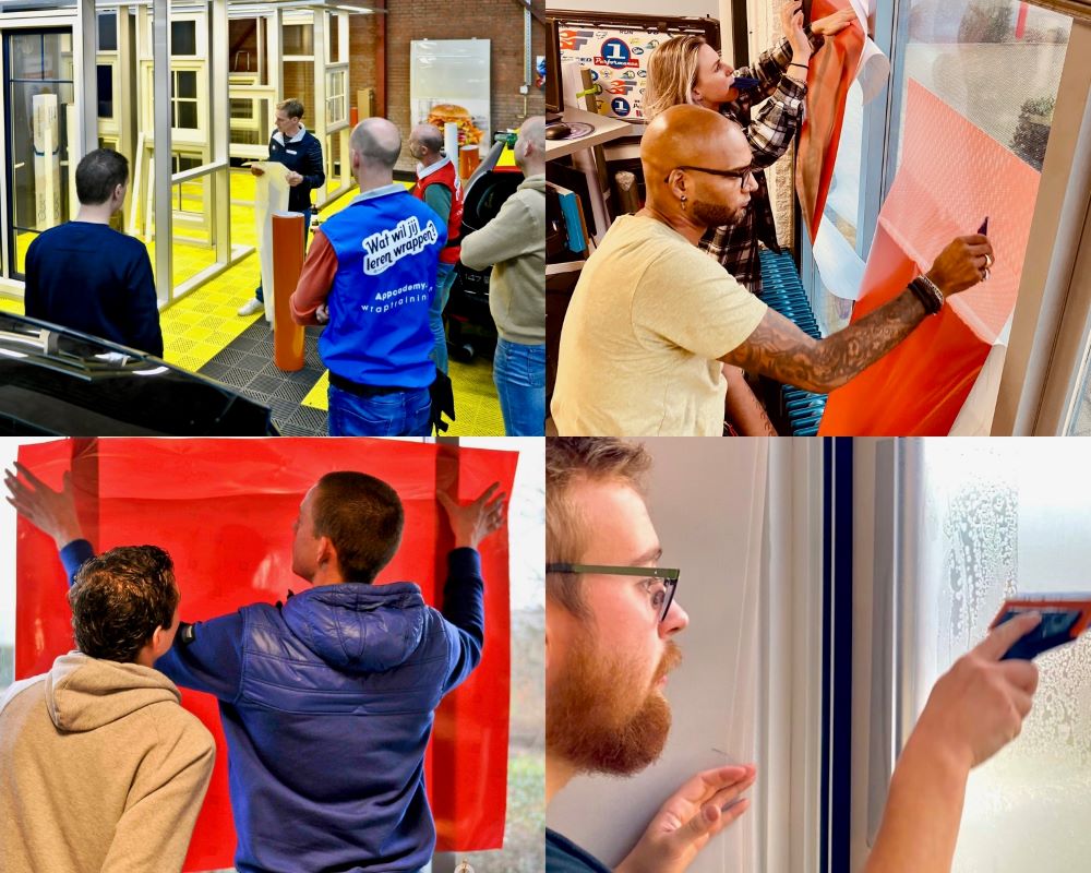 Trainer en cursisten appliceren zelfklevende foliesoorten op glas als praktijk oefening tijdens de Appcademy signmaker training en opleiding