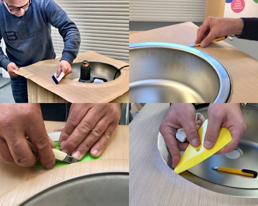 Cursisten beplakken aanrechtblad rond spoelbak als praktijkoefening tijdens de Appcademy training interieurfolie appliceren en keukens wrappen