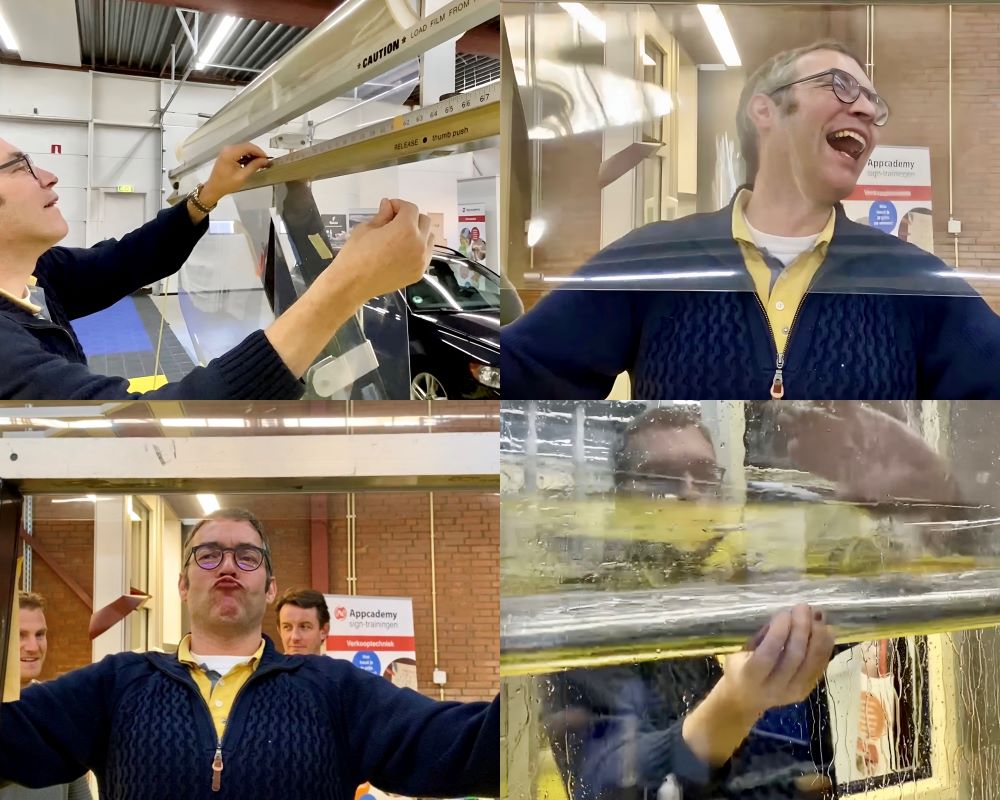 Trainer demonstreert afsnijden van raamfolie op maat met folie dispencer tijdens Appcademy Architectural Windowfilm cursus